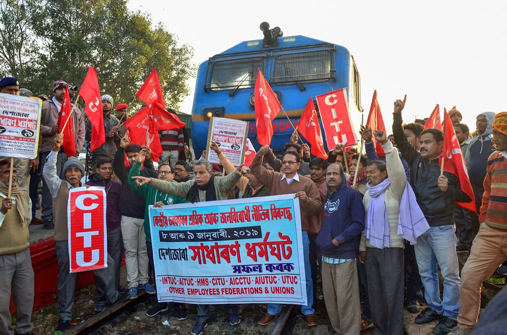 Guwahati: Centre of Indian Trade Union (CITU) activists and ally organizations block a train during the 48-hour-long nationwide general strike called by central trade unions protesting against the "anti-people" policies of the Centre, in Guwahati, Tuesday, Jan 8, 2019. (PTI Photo) (PTI1_8_2019_000044B)