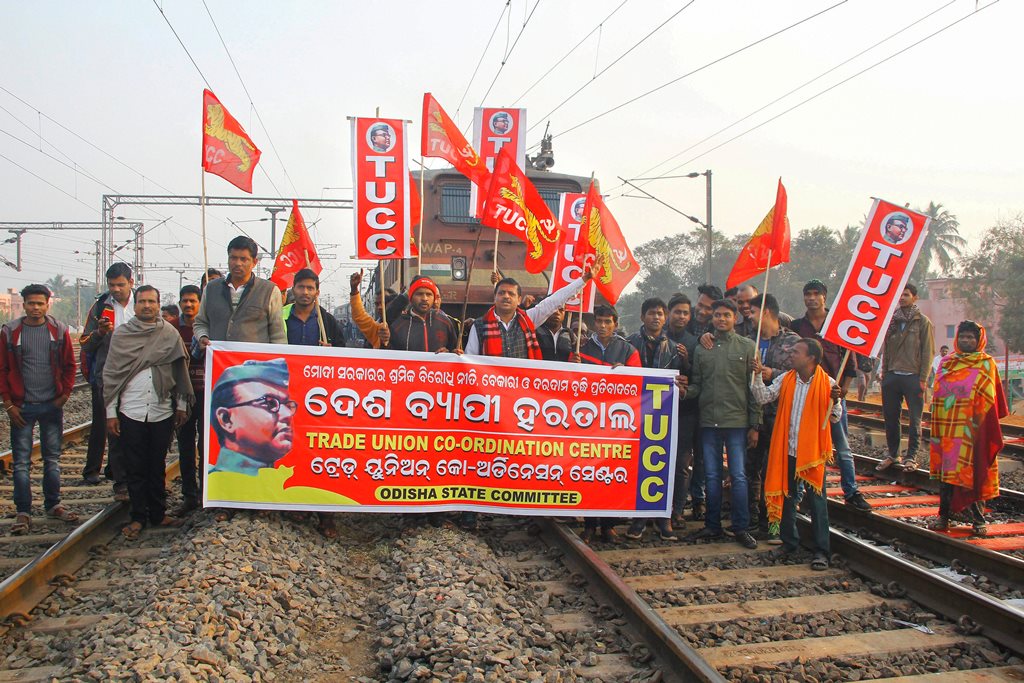 Bhubaneswar: Central trade union activists block a train during their 48-hour-long nationwide general strike in protest against the 