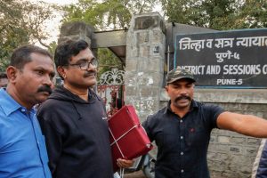 Pune: Activist Anand Teltumbde (black pullover) leaves after Pune District and Sessions Court released him in Bhima Koregaon case, in Pune, February 2, 2019. (PTI Photo) (PTI2_2_2019_000195B)