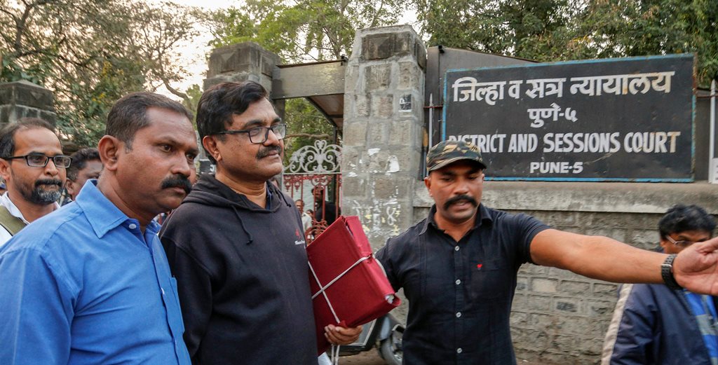 Pune: Activist Anand Teltumbde (black pullover) leaves after Pune District and Sessions Court released him in Bhima Koregaon case, in Pune, February 2, 2019. (PTI Photo) (PTI2_2_2019_000195B)