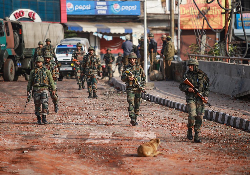 Jammu: Army personnel patrol a street during a curfew, imposed after clashes between two communities over the protest against the Pulwama terror attack, in Jammu, Saturday, Feb. 16, 2019. (PTI Photo)(PTI2_16_2019_000057B)