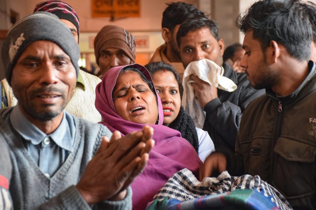 Saharnapur: Family members of victims who are undergoing treatment on being poisoned after consuming a spurious liquor, at a hospital in Saharanpur, Saturday, Feb 9, 2019. The death toll in the hooch tragedy that hit two adjoining districts in Uttarakhand and Uttar Pradesh has risen to 70 with more people dying of the spurious liquor. (PTI Photo) (PTI2_9_2019_000099B)