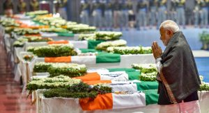 New Delhi: Prime Minister Narendra Modi pays tribute to the martyred CRPF jawans, who lost their lives in Thursday's Pulwama terror attack, after their mortal remains were brought at AFS Palam in New Delhi, Friday, Feb 15, 2019. (PTI Photo/Manvender Vashist) (PTI2_15_2019_000235B)