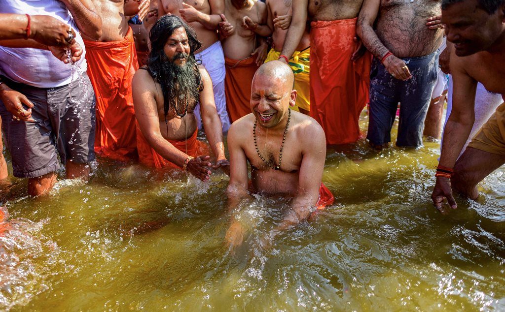 Allahabad: Uttar Pradesh Chief Minister Yogi Adityanath takes a holy dip in the water of River Ganga at Sangam during the ongoing Kumbh Mela-2019, in Allahabad, Tuesday, Jan. 29, 2019. (PTI Photo)(PTI1_29_2019_000066B)
