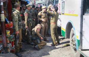 Jammu: Police personnel inspect the site after a powerful explosion at a bus stand, in Jammu, Thursday, March 07, 2019. (PTI Photo)(PTI3_7_2019_000022B)