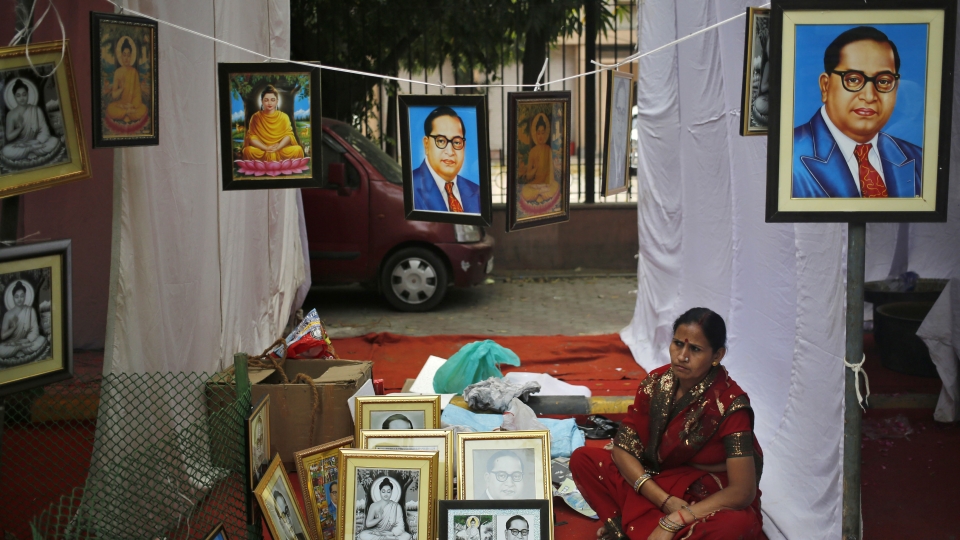 A vendor sells portraits of BR Ambedkar on a pavement in New Delhi. (Photo: Reuters)
