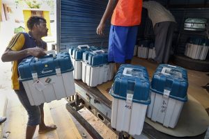Chennai: Workers carry boxes containing Electronic Voting Machines (EVM) and Voter Verified Paper Audit Trail machines (VVPATs) at a distribution centre, ahead of the second phase of the 2019 Lok Sabha elections, at Nandhanam Arts College in Chennai, Wednesday, April 17, 2019. (PTI Photo/R Senthil Kumar)(PTI4_17_2019_000108B)