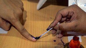 Bardhaman: A voter gets her finger marked with indelible ink before casting vote at a polling station, during the 4th phase of Lok Sabha elections, in Bardhaman, Monday, April 29, 2019. (PTI Photo)(PTI4_29_2019_000107B)