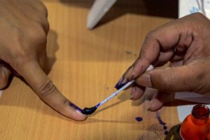 Bardhaman: A voter gets her finger marked with indelible ink before casting vote at a polling station, during the 4th phase of Lok Sabha elections, in Bardhaman, Monday, April 29, 2019. (PTI Photo)(PTI4_29_2019_000107B)