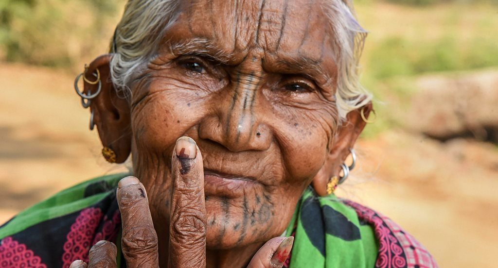 Kandhamaal: An elderly voter show her finger marked with indelible ink at Adabadi polling booth during the second phase of Lok Sabha elections in Kandhamaal, Thursday, April 18, 2019. PTI Photos