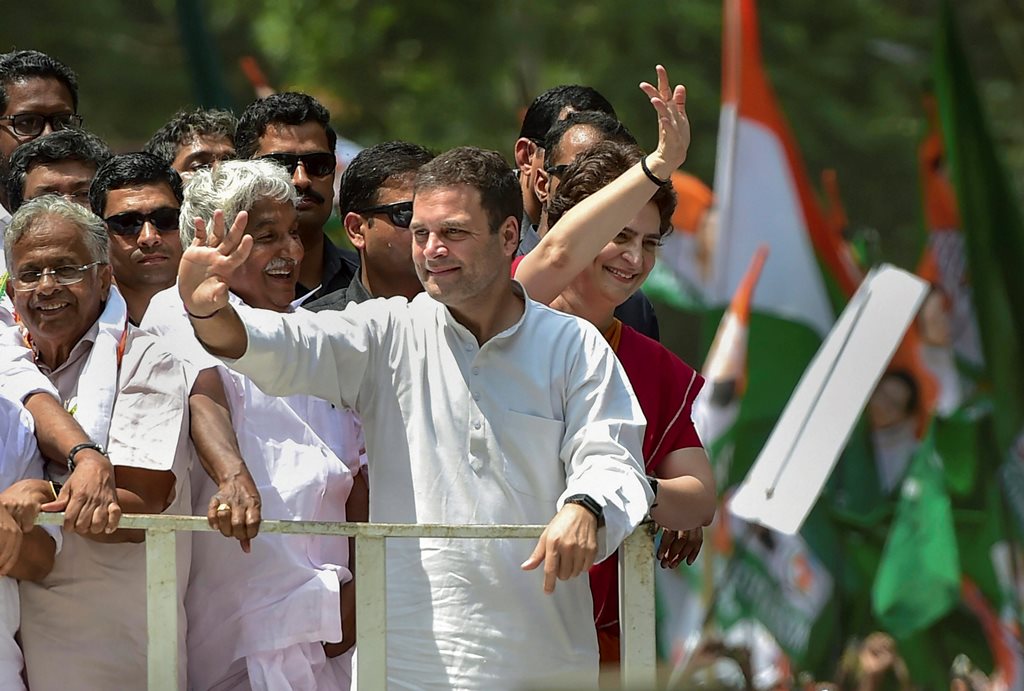 Wayanad: Congress President Rahul Gandhi along with party General Secretary and Uttar Pradesh - East in charge Priyanka Gandhi Vadra and other leaders wave at party supporters during a roadshow ahead of the former's nomination filing, ahead of the Lok Sabha elections, in Wayanad, Thursday, April 4, 2019. (PTI Photo/Shailendra Bhojak)(PTI4_4_2019_000065B)
