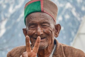 Kalpa: Shyam Sharan Negi, independent India's first voter, flashes victory sign, at his residence in Kalpa, of Himachal Pradesh Kinnaur district, on Friday, April 05, 2019. PTI Photos