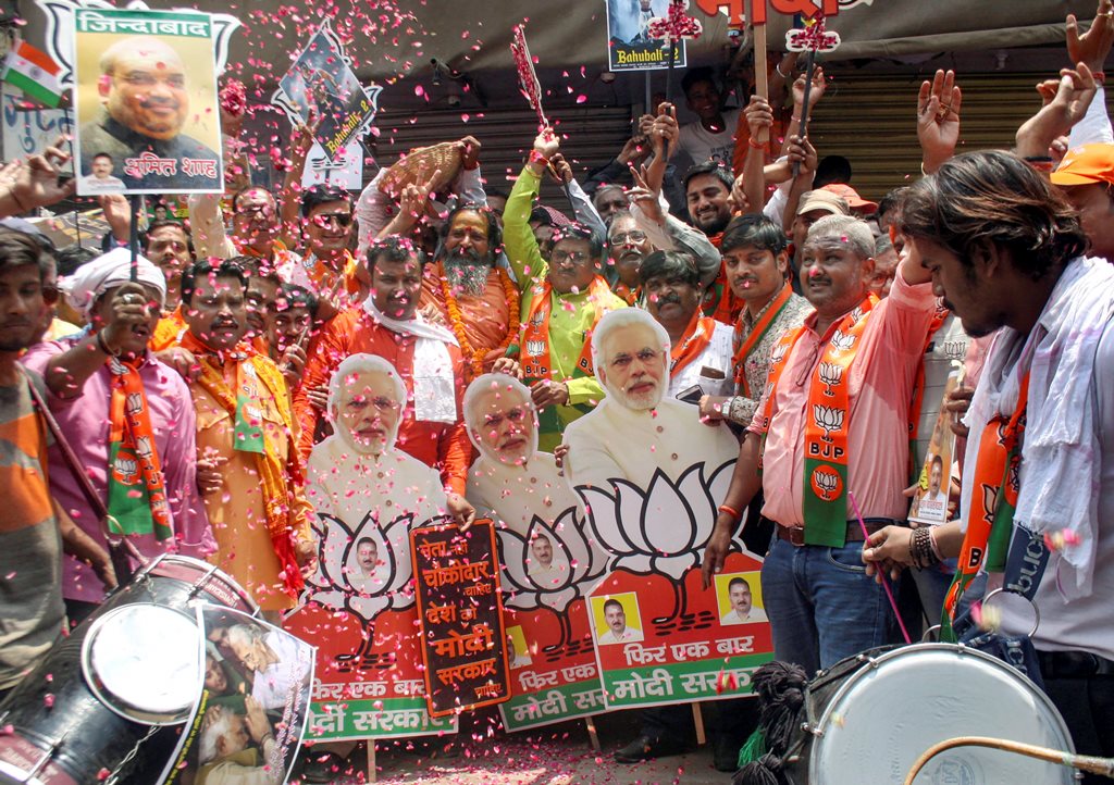 Varanasi: BJP workers celebrate party's lead in the Lok Sabha elections 2019, in Varanasi, Thursday, May 23, 2019. (PTI Photo) (PTI5_23_2019_000087B)