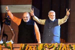 New Delhi: Bhartiya Janata Party workers welcome Prime Minister Narendra Modi as he, along with BJP President Amit Shah, arrives at the party headquarters to celebrate the party's victory in the 2019 Lok Sabha elections, in New Delhi, Thursday, May 23, 2019. (PTI Photo/Manvender Vashist) PTI5_23_2019_000477B