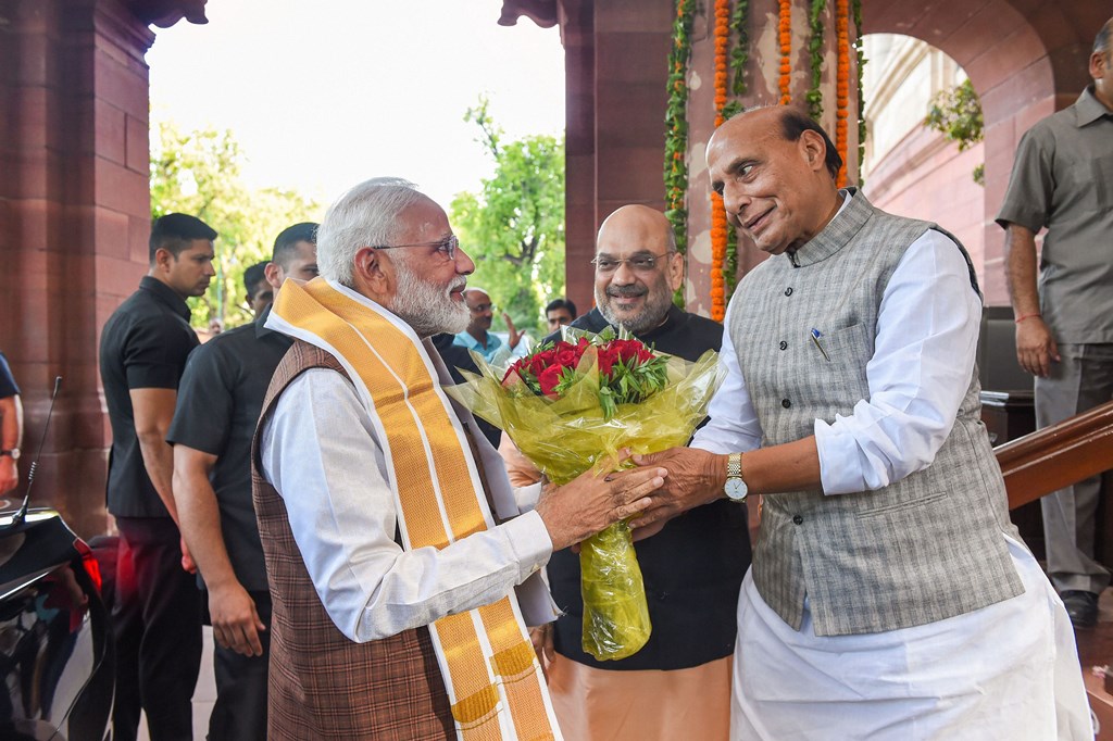 New Delhi: Prime Minister Narendra Modi being greeted by BJP leader Rajnath Singh upon his arrival at Parliament House, in New Delhi, Saturday, May 25, 2019. (PTI Photo/Atul Yadav) (PTI5_25_2019_000151B)(PTI5_25_2019_000202B)