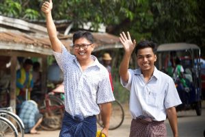 Yangon: Reuters journalists Wa Lone, left, and Kyaw She Oo wave as they walk out from Insein Prison after being released in Yangon, Myanmar Tuesday, May 7, 2019. The chief of the prison said two Reuters journalists who were imprisoned for breaking the country's Officials Secrets Act have been released. AP/PTI(AP5_7_2019_000022B)