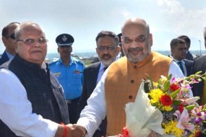 Srinagar: Union Home Minister Amit Shah being received by Jammu and Kashmir Governor Satya Pal Malik on his arrival at the airport in Srinagar, Wednesday, June 26, 2019, for a two-day visit to the Valley to review the security arrangements in the view of Amarnath Yatra. (PTI Photo) (PTI6_26_2019_000124B)