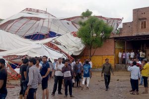 Barmer: Panic stricken people after a pandal fell during a Ram Katha due to storm in Jasol village of Barmer district of Rajasthan, Sunday, June 23, 2019. At least 14 people reportedly dead in the mishap. (PTI Photo)