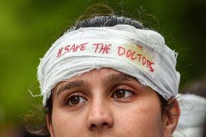 Bengaluru: A medical student during a demonstration protest to show solidarity with their counterparts against the assault in Kolkata, in Bengaluru, Friday, June 14, 2019. (PTI Photo/Shailendra Bhojak)