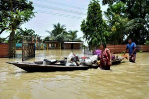 Kamrup: People shift belongings from their submerged house at a flood-affected area, at Hatishila in Kamrup, Tuesday, July 16, 2019. (PTI Photo) (PTI7_16_2019_000096B)