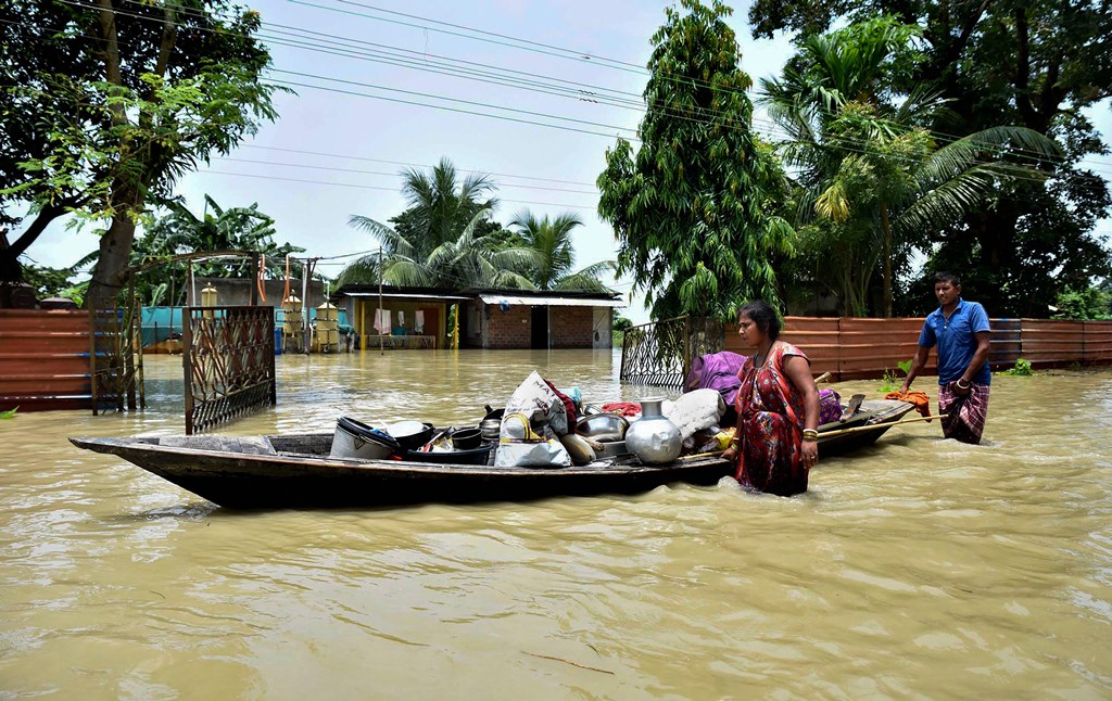 Kamrup: People shift belongings from their submerged house at a flood-affected area, at Hatishila in Kamrup, Tuesday, July 16, 2019. (PTI Photo) (PTI7_16_2019_000096B)
