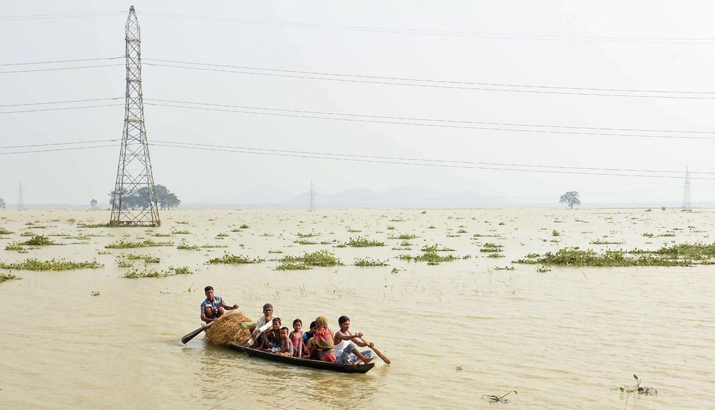Morigaon: Villagers relocate to a safer place from their flood-affected village following monsoon rains, in Morigoan, Friday, July 19, 2019. (PTI Photo) (PTI7_19_2019_000228B)