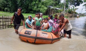 Barpeta: State Disaster Response Force (SDRF) personnel rescue villagers affected by flood at Sarukhetri village in Barpeta, Thursday, July 25, 2019. (PTI Photo) (PTI7_25_2019_000117B) *** Local Caption ***