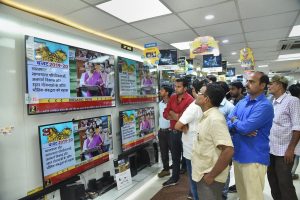 Patna: People watch Finance Minister Nirmala Sitharaman tabling the Union Budget 2019-20, on TV sets at a showroom in Patna, Friday, July 5, 2019. (PTI Photo)(PTI7_5_2019_000062B)