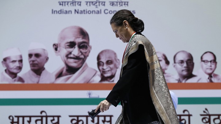 Sonia Gandhi, Chief of India's ruling Congress party, walks to address her party workers at the All India Congress Committee (AICC) meeting in New Delhi January 17, 2014. REUTERS/Adnan Abidi (INDIA - Tags: POLITICS) - GM1EA1H1OUK01