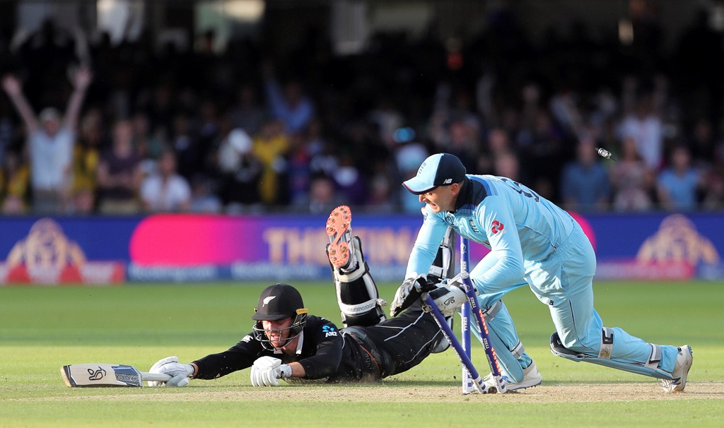 London: England's Jos Buttler runs out New Zealand's Martin Guptill during the Super Over in the Cricket World Cup final match between England and New Zealand at Lord's cricket ground in London, England, Sunday, July 14, 2019. AP/PTI(PTI7_15_2019_000030B)