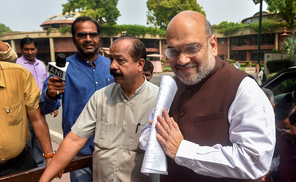 New Delhi: Union Home Minister Amit Shah arrives at Parliament for the Budget Session, in New Delhi, Monday, Aug 5, 2019. Home Minister will make a statement in Parliament today amidst speculation that it could be on Jammu and Kashmir.(PTI Photo/Manvender Vashist) (PTI8_5_2019_000033B)