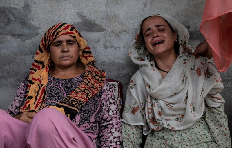 Bilquis, sister of Irfan Ahmad Hurra, who was arrested during a clampdown after the scrapping of the special constitutional status for Kashmir by the government, cries, as their mother Jameela looks on, while they remember Irfan inside their house in Pulwama, south of Srinagar, August 13, 2019. REUTERS/Danish Siddiqui