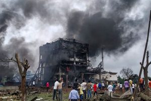 Dhule: Smoke rises from the charred remains of chemical factory after cylinder explosion in Dhule Maharashtra, Saturday, Aug 31, 2019. PTI Photos.