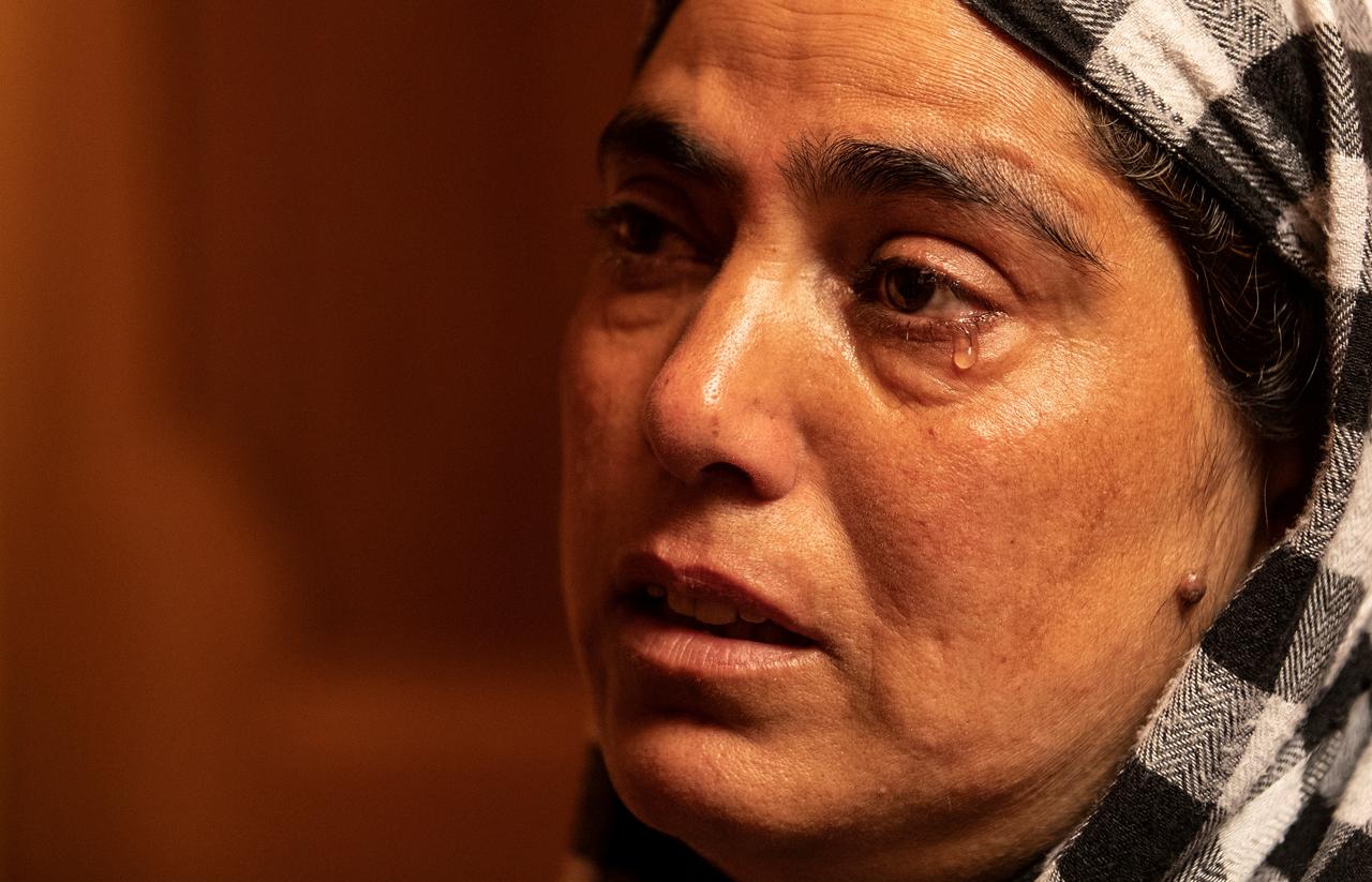 Fareeda, wife of Shameem Ahmad Ganai, who according to Fareeda was arrested during a clampdown a day before the scrapping of the special constitutional status for Kashmir by the government, cries as she remembers him inside her house in Pulwama, south of Srinagar, August 13, 2019. REUTERS/Danish Siddiqui