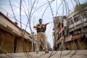 Jammu: CRPF personnel stand guard during restrictions, at Raghunath Bazar in Jammu, Monday, Aug 05, 2019. Restrictions and night curfews were imposed in several districts of Jammu and Kashmir as the Valley remained on edge with authorities stepping up security deployment. (PTI Photo)(PTI8_5_2019_000091B)