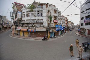 Jammu: Security personnel guard in the Raghunath Bazar during restrictions in Jammu, Tuesday, Aug 6, 2019. Restrictions and night curfews were imposed in several districts of Jammu and Kashmir in the view of the revocation of Article 370 and introduction J & K Reorganisation Bill in Parliament. (PTI Photo) (PTI8_6_2019_000053B)
