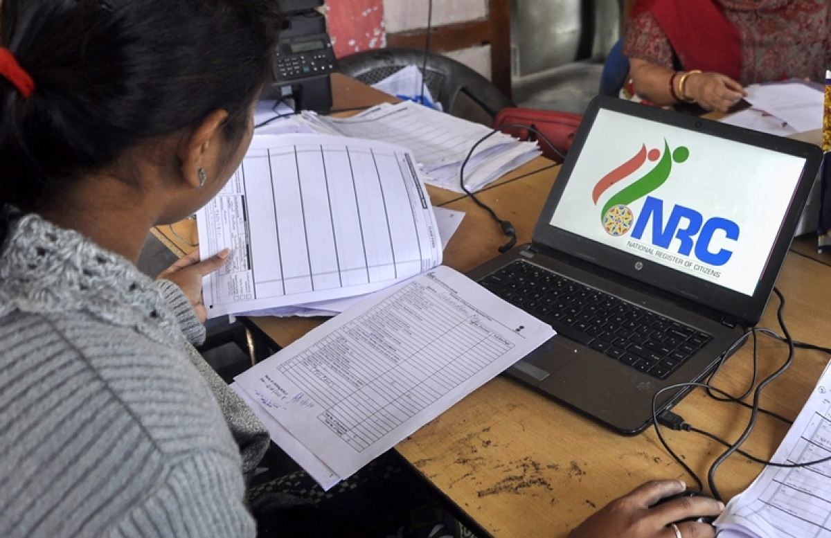 Data entry operators of National Register of Citizens (NRC) carry out correction of names and spellings at an NRC Seva Kendra at Birubari in Guwahati. PTI Photo