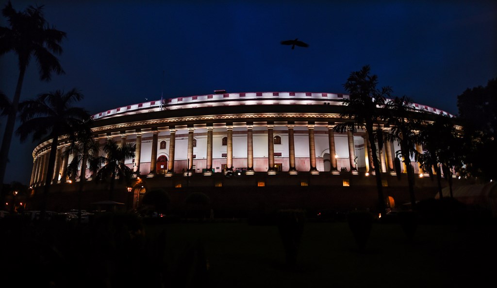 New Delhi: A view of an illuminated Parliament House in New Delhi, Tuesday, Aug 6, 2019. The Lok Sabha approved the abrogation of special status given to J&K under Article 370 today. (PTI Photo/Kamal Singh) (PTI8_6_2019_000220B)