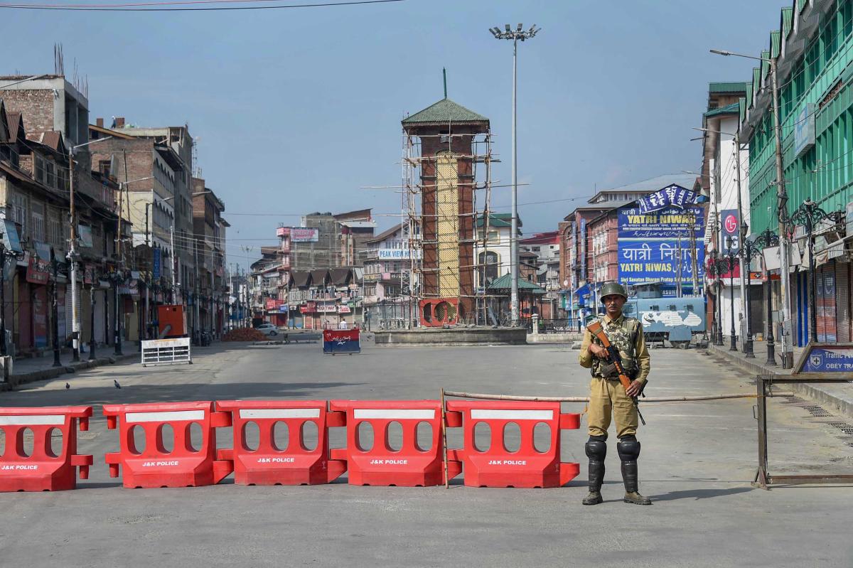 Security personnel stands guard during restrictions, in Srinagar. PTI 