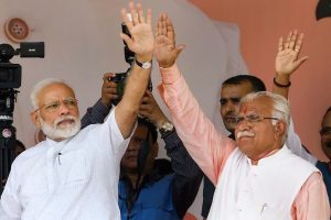 Rohtak: Prime Minister Narendra Modi with Haryana Chief Minister Manohar Lal waves at the crowd during a public rally in Rohtak, Sunday, Sept 8, 2019. (PTI Photo) (PTI9_8_2019_000061B)