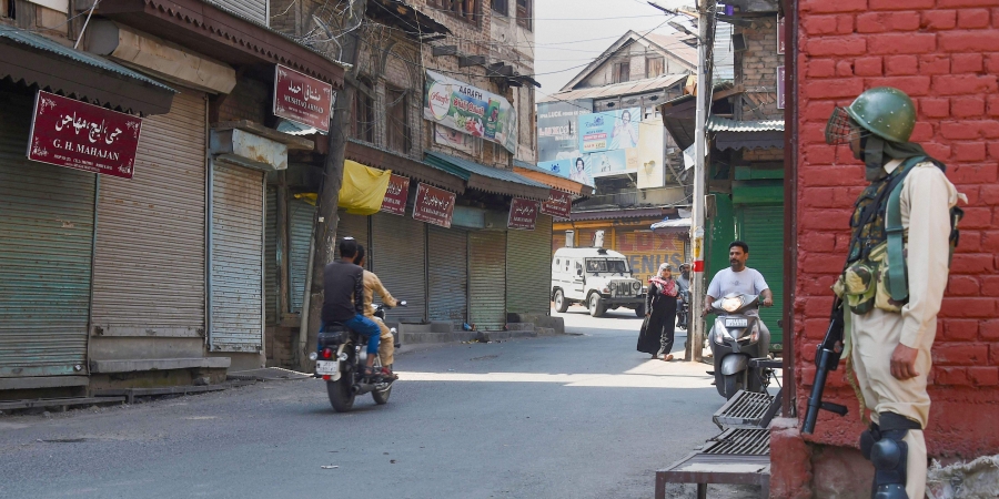 A security personnel stands guard during restrictions in Downtown Srinagar Friday September 13 2019. | PTI