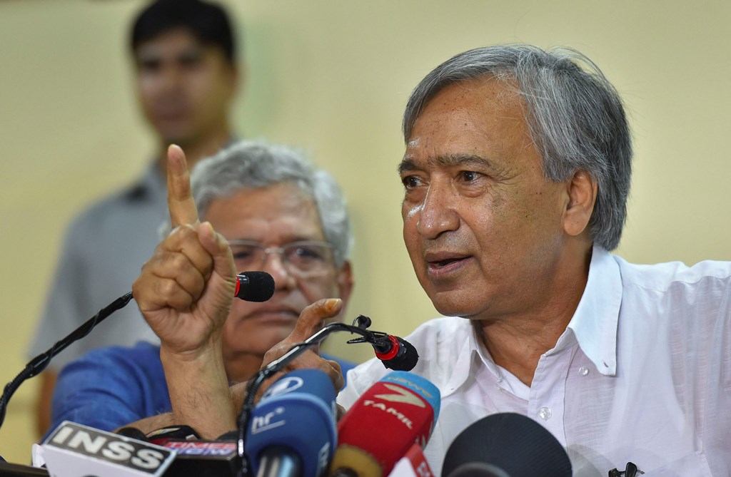 New Delhi: CPI(M) leader Mohd Yousuf Tarigami with party General Secretary Sitaram Yechury addresses a press conference, in New Delhi, Tuesday, Sept. 17, 2019. The Supreme Court on Monday said that Tarigami is at liberty to go back to Srinagar as and when he feels that his health allows him to undertake the journey. (PTI Photo/Kamal Kishore) (PTI9_17_2019_000082B)