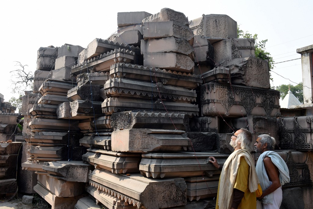 Ayodhya: Visitors look at stone slabs, carved-out for the construction of Ram Temple, at Shri Ram Janmbhoomi Karyashala (workshop) in Karsewakpuram, Ayodhya, Monday, Nov. 11, 2019. (PTI Photo) (PTI11_11_2019_000206B)