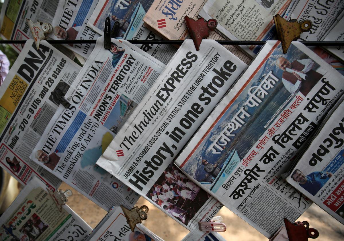 Newspapers, with headlines about Prime Minister Narendra Modi's decision to revoke special status for the disputed Kashmir region, are displayed for sale at a pavement in Ahmedabad, August 6, 2019. REUTERS/Amit DaveNewspapers, with headlines about Prime Minister Narendra Modi's decision to revoke special status for the disputed Kashmir region, are displayed for sale at a pavement in Ahmedabad, August 6, 2019. REUTERS/Amit Dave