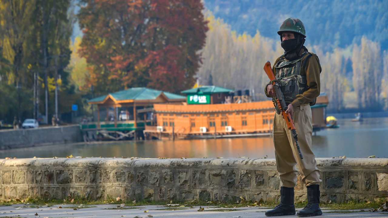 A security person keeps vigil near the Raj Bhawan after bifurcation of the Jammu and Kashmir, in Srinagar on October 31. (Photo: PTI)
