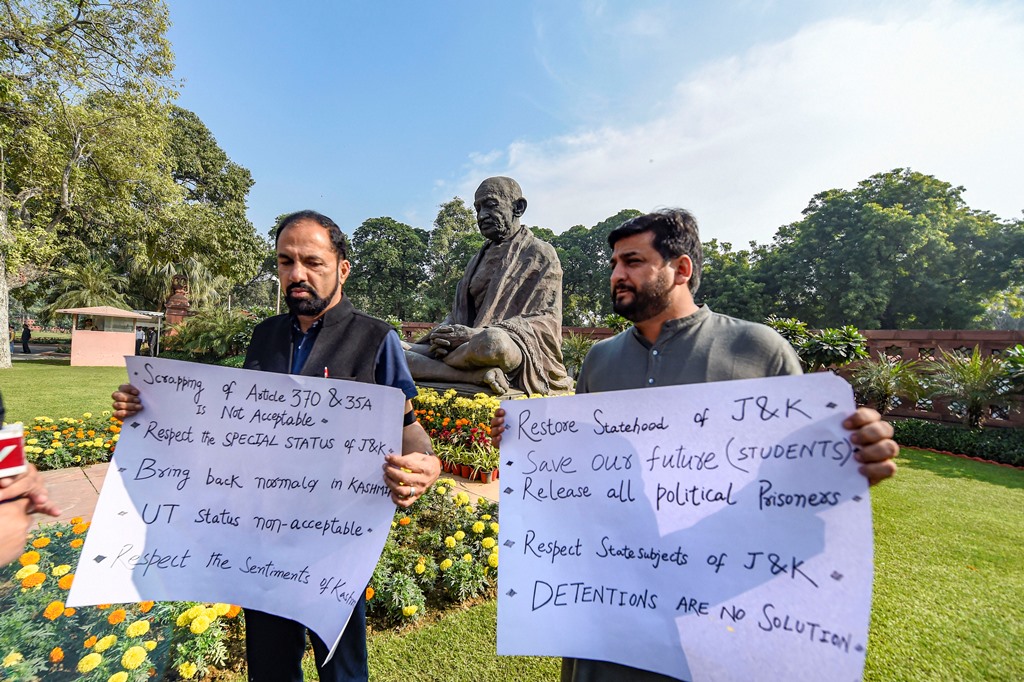New Delhi: PDP MPs from Jammu and Kashmir Fayaz Ahmad Mir and Nazir Ahmad Laway display placards to protest over Jammu and Kashmir issue on the first day of the Winter Session of Parliament, in New Delhi, Monday, Nov. 18, 2019. (PTI Photo/Atul Yadav)(PTI11_18_2019_000047B)