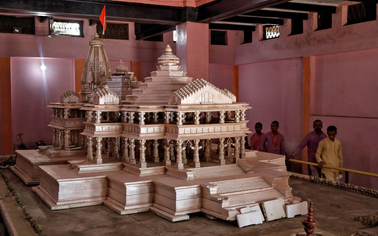 Devotees look at a model of the proposed Ram temple that Hindu groups want to build at a disputed religious site in Ayodhya, India, October 22, 2019. REUTERS/Danish Siddiqui