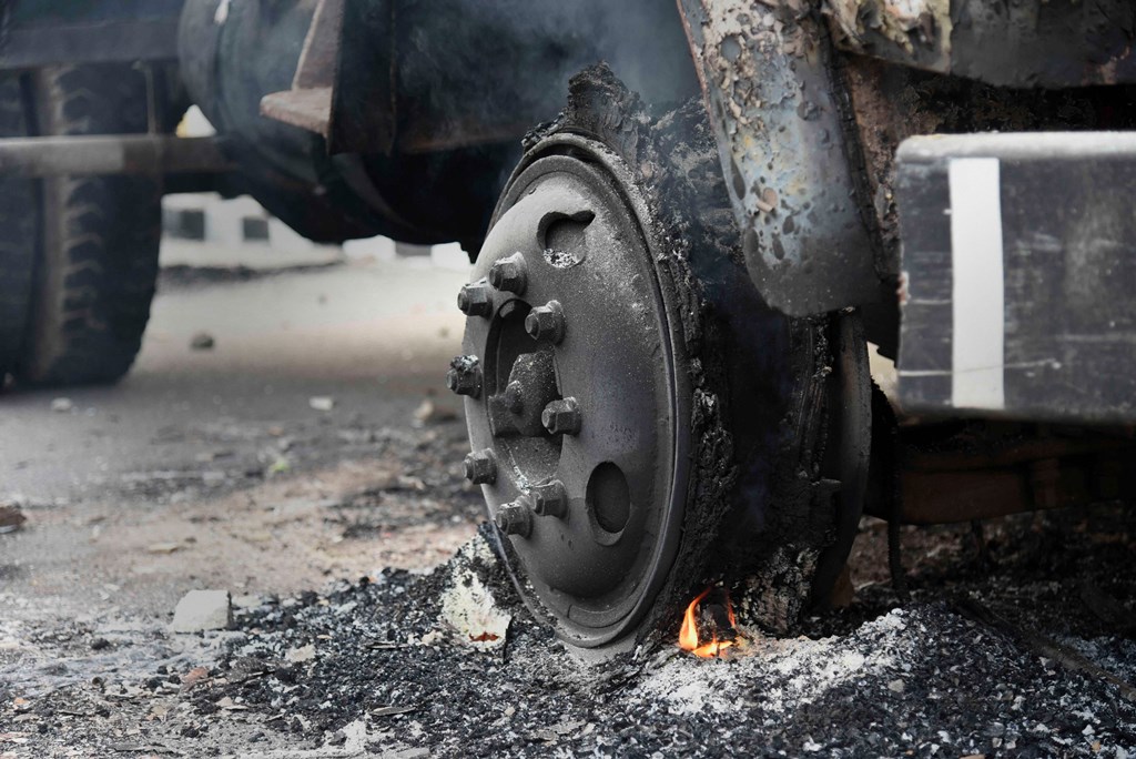 Guwahati: Charred vehicles which were allegedly set on fire by protestors during unrest against the Citizenship Amendment Bill yesterday, are seen on a roadside in Guwahati, Thursday, Dec. 12, 2019. Guwahati, the epicentre of anti-CAB protests, was placed under indefinite curfew last night while the Army was called in at four places and Assam Rifles personnel were deployed in Tripura on Wednesday as the two northeastern states plunged into chaos over the hugely emotive Citizenship (Amendment) Bill or CAB. (PTI Photo) (PTI12_12_2019_000062B) *** Local Caption ***