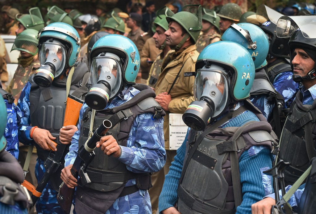 New Delhi: Security personnel with anti-teargas masks standby during protests against the Citizenship (Amendment) Act after Friday prayers, at Darya Ganj in New Delhi, Friday, Dec. 20, 2019. (PTI Photo/Kamal Kishore)(PTI12_20_2019_000069B)
