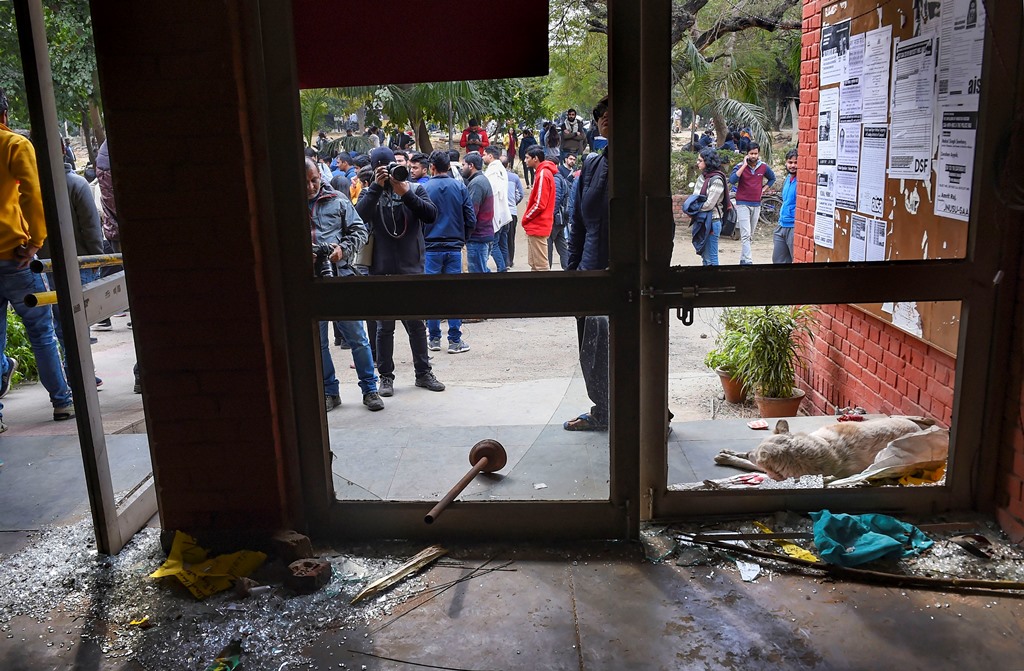 New Delhi: Shattered glass of doors are seen at the Sabarmati Hostel following the Sundays violence at the Jawaharlal Nehru University (JNU) , in New Delhi, Monday, Jan. 6, 2020. A group of masked men and women armed with sticks, rods and acid allegedly unleashed violence on the campus of the University, Sunday evening. (PTI Photo/Atul Yadav) (PTI1 6 2020 000072B)